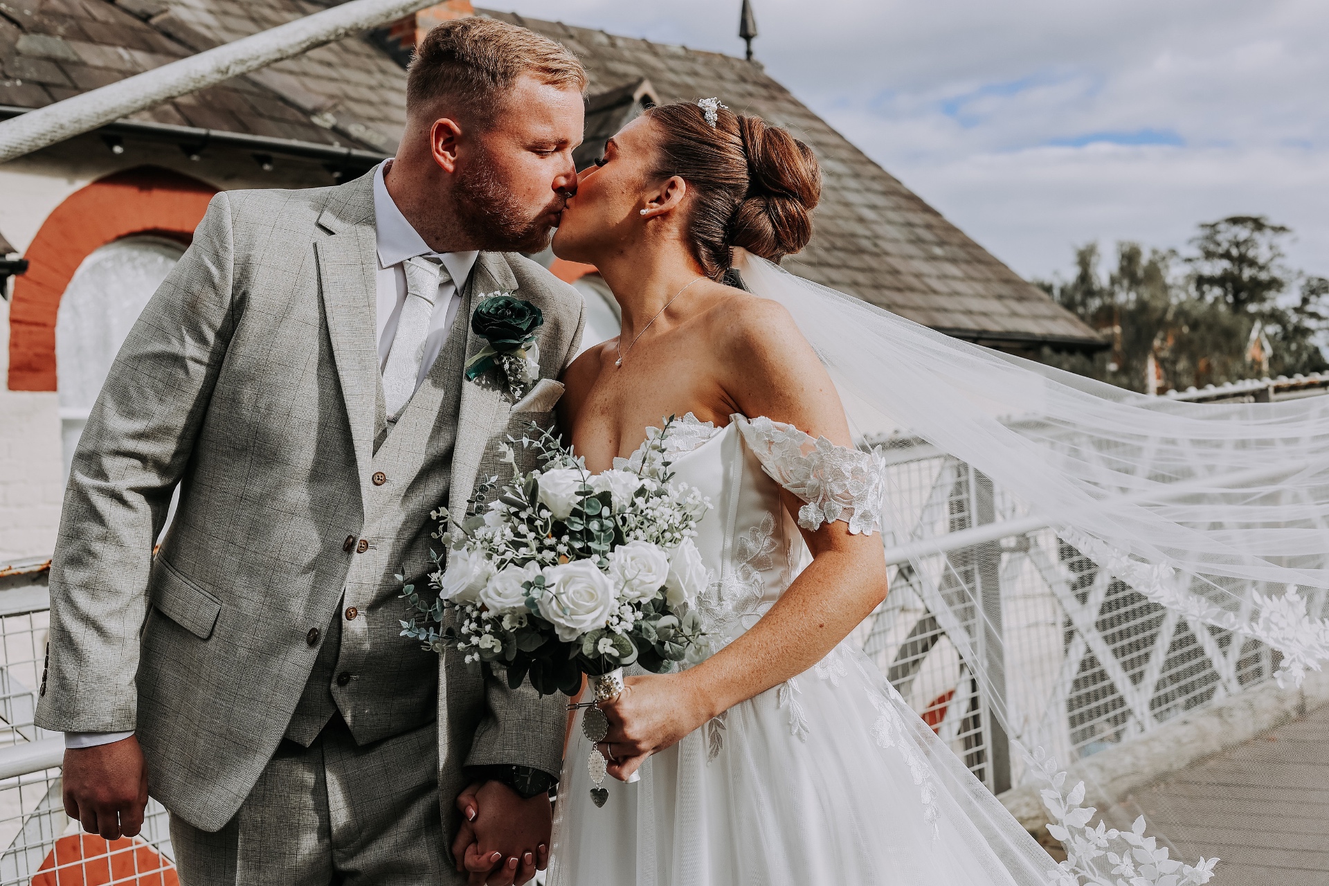 Bride and groom with bouquet detail